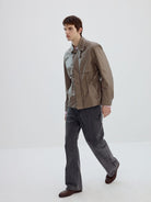 SIMPLE PROJECT Coated Drawstring Hunting Jacket in Beige - On Male Model