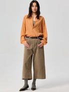 SIMPLE PROJECT Lyocell Ramie Pleated V Neck Shirt in Orange - On Female Model