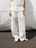 Random Piece Embroidered Cutout Wide Leg Pants in White - On Female Model