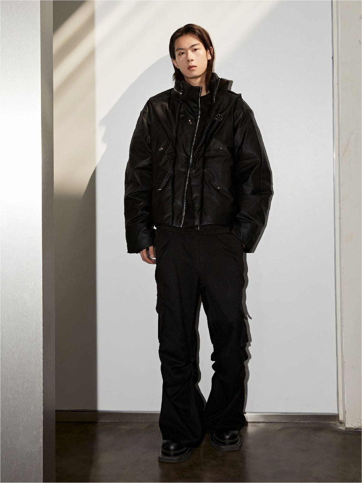 Y OFFICIAL Cropped Faux Leather Down Puffer in Black - On Male Model
