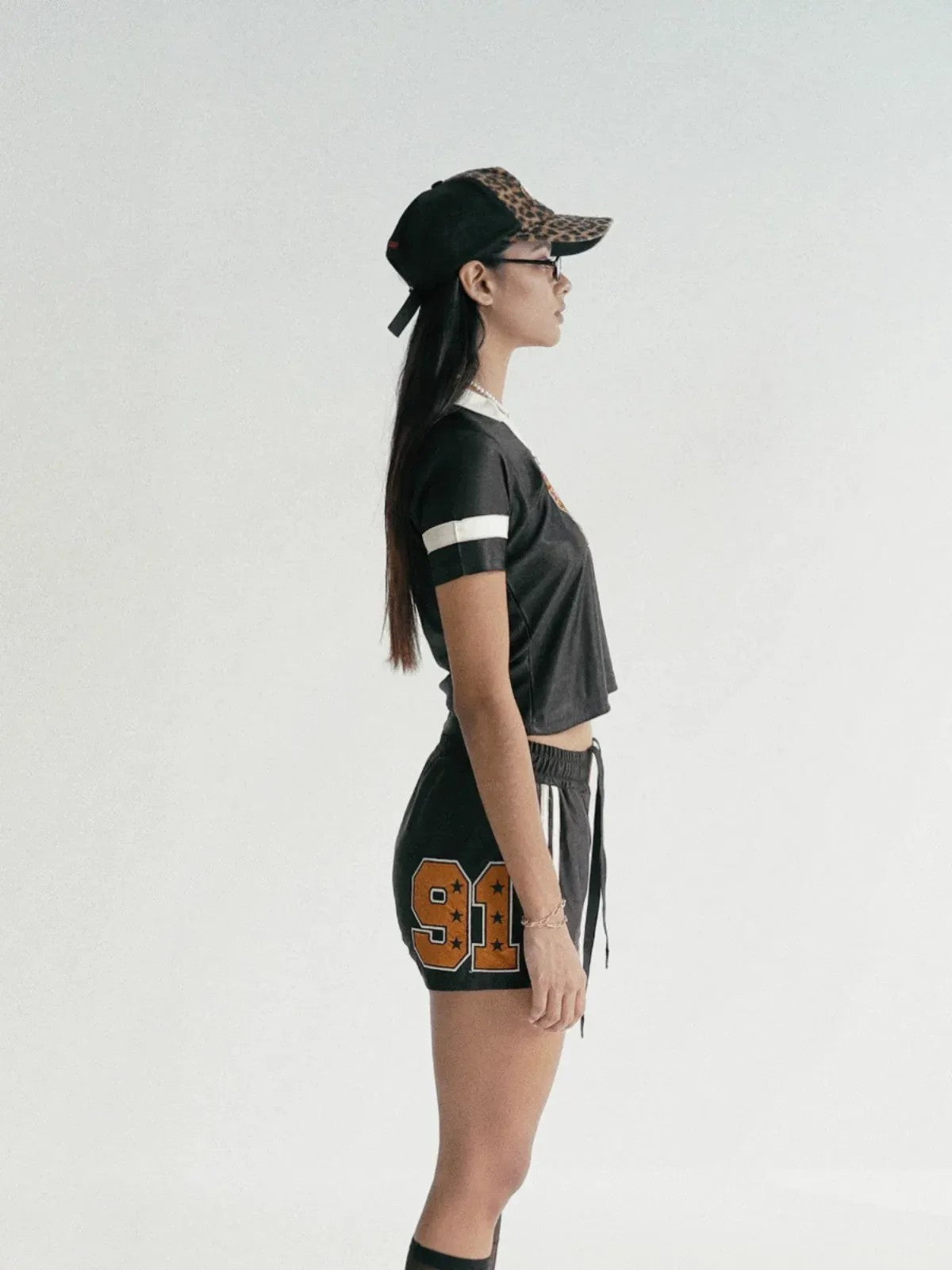 BADSEED Cropped Graphic Baseball Jersey in Black - On Female Model