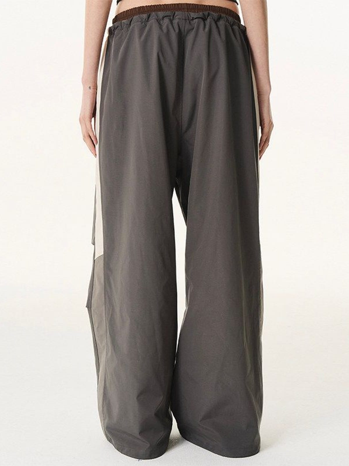 BLINDNOPLAN Contrast Panel Pleated Parachute Pants in Gray - On Model