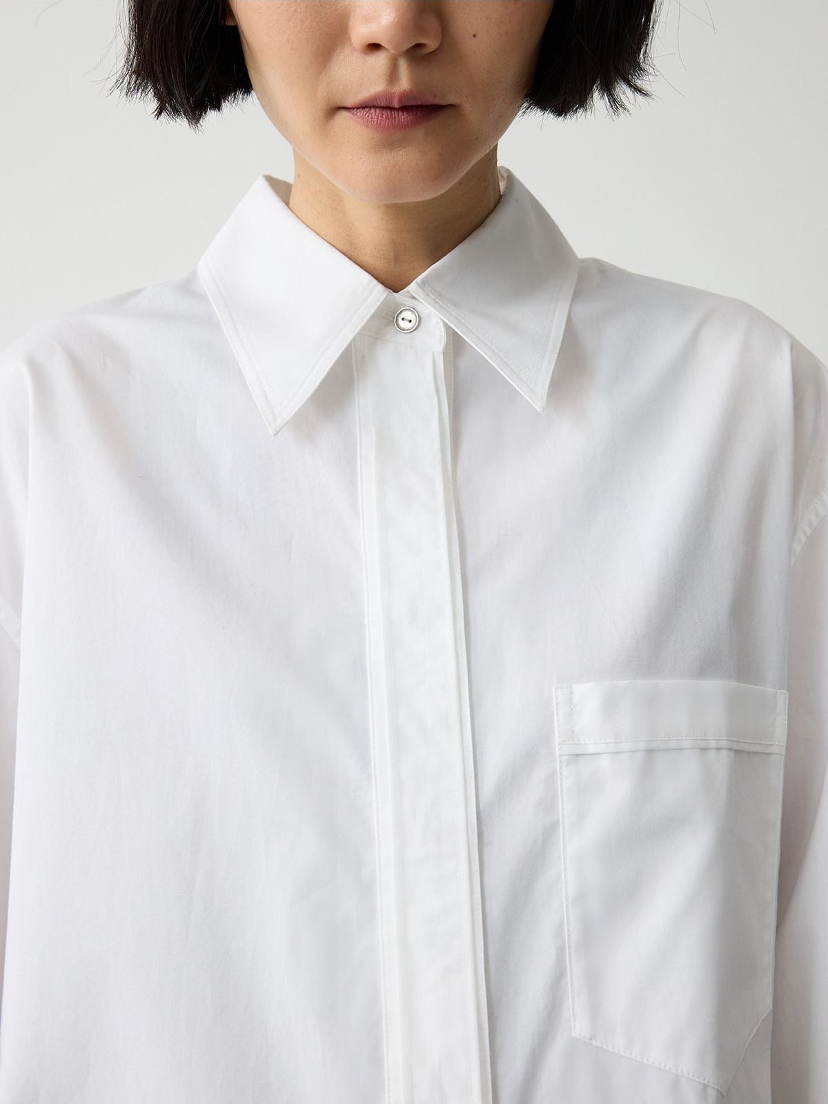 Random Piece Oversized Cotton Button Down Shirt in White - On Female Model