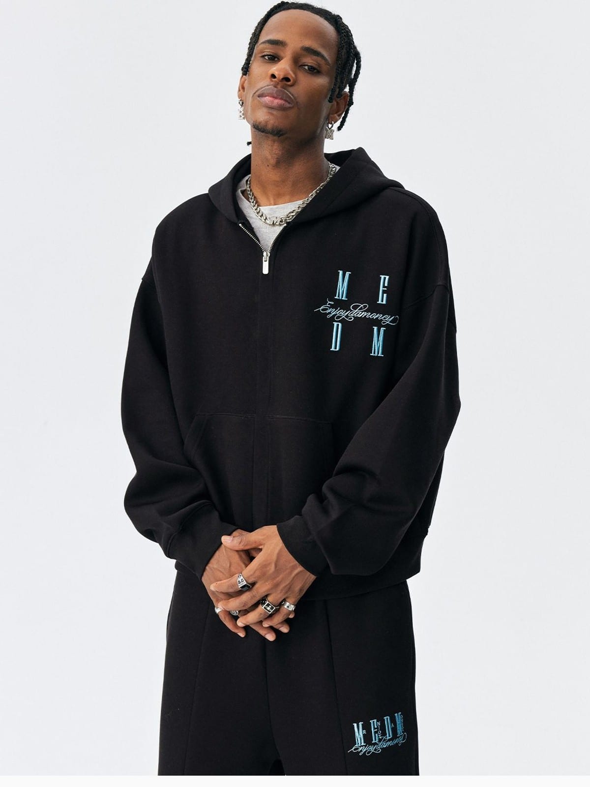 MEDM Embroidered Cotton Blend Zip Up Hoodie in Black - On Male Model