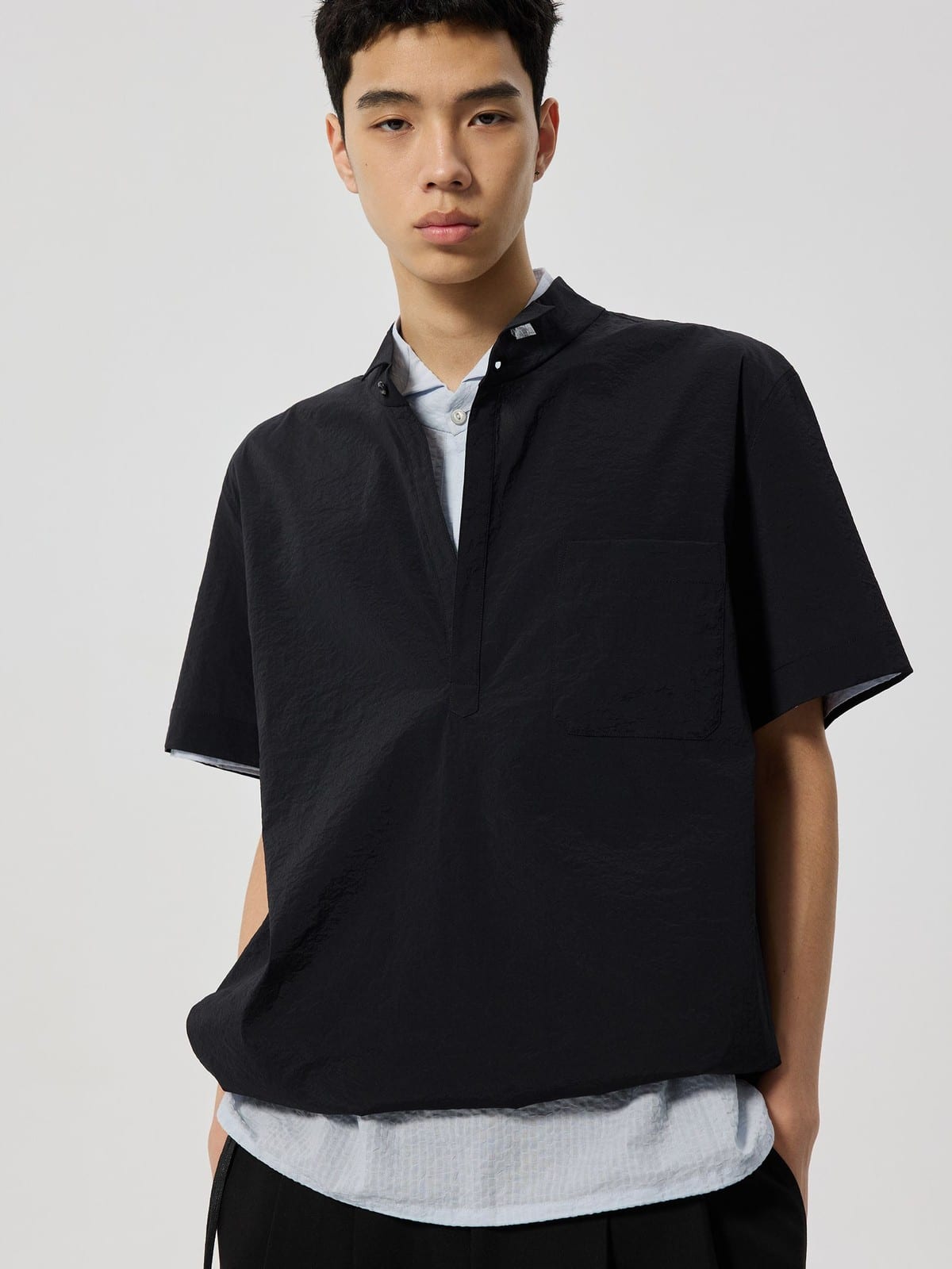 SIMPLE PROJECT Nylon Half Placket Short Sleeve Shirt in Black - On Male Model