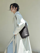 QIUZHEN Vegetable Tanned Leather Bucket Bag in Black - On Female Model