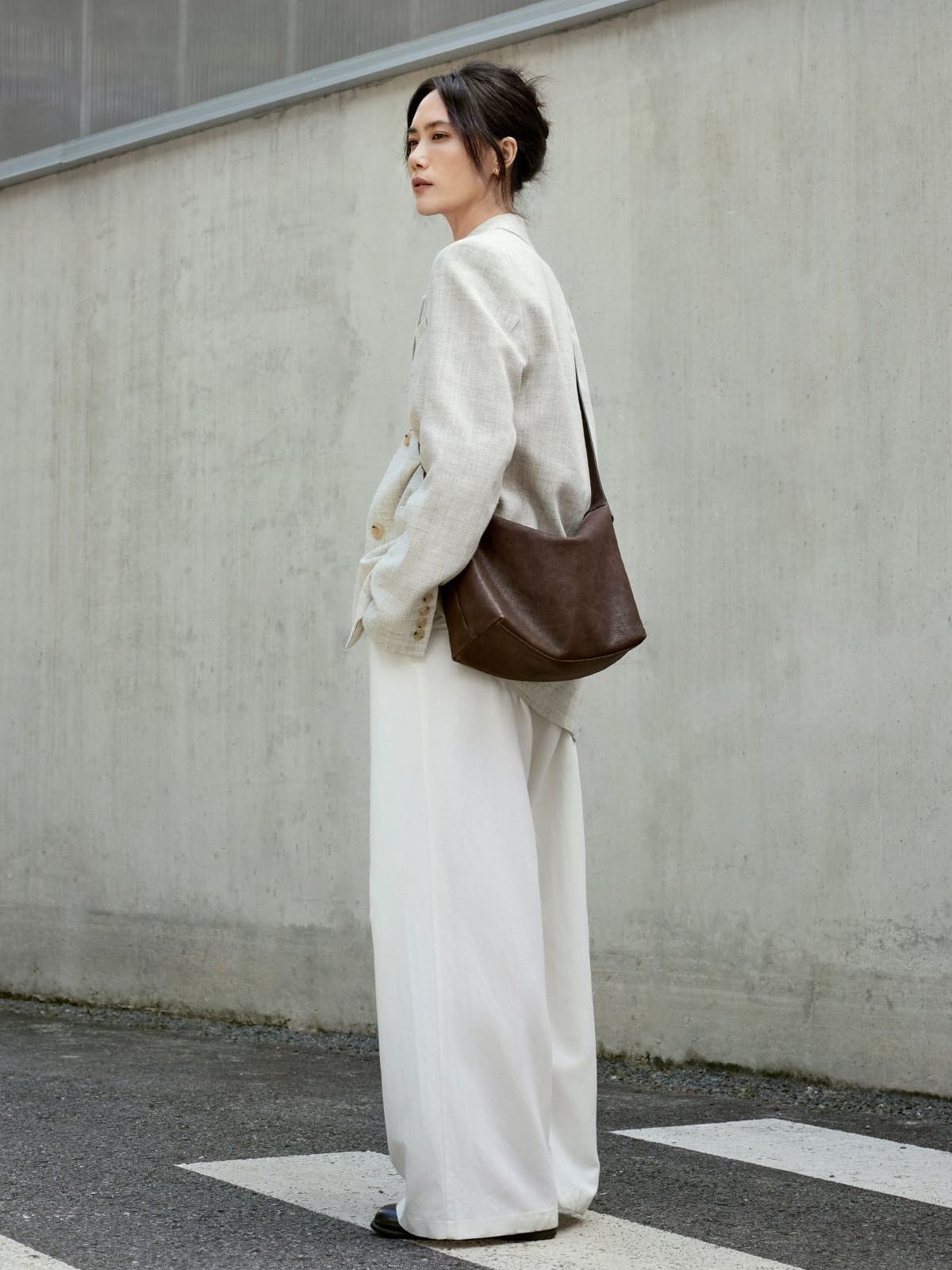 QIUZHEN Vegetable Tanned Calfskin Hobo Bag in Brown - On Female Model
