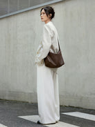 QIUZHEN Vegetable Tanned Calfskin Hobo Bag in Brown - On Female Model