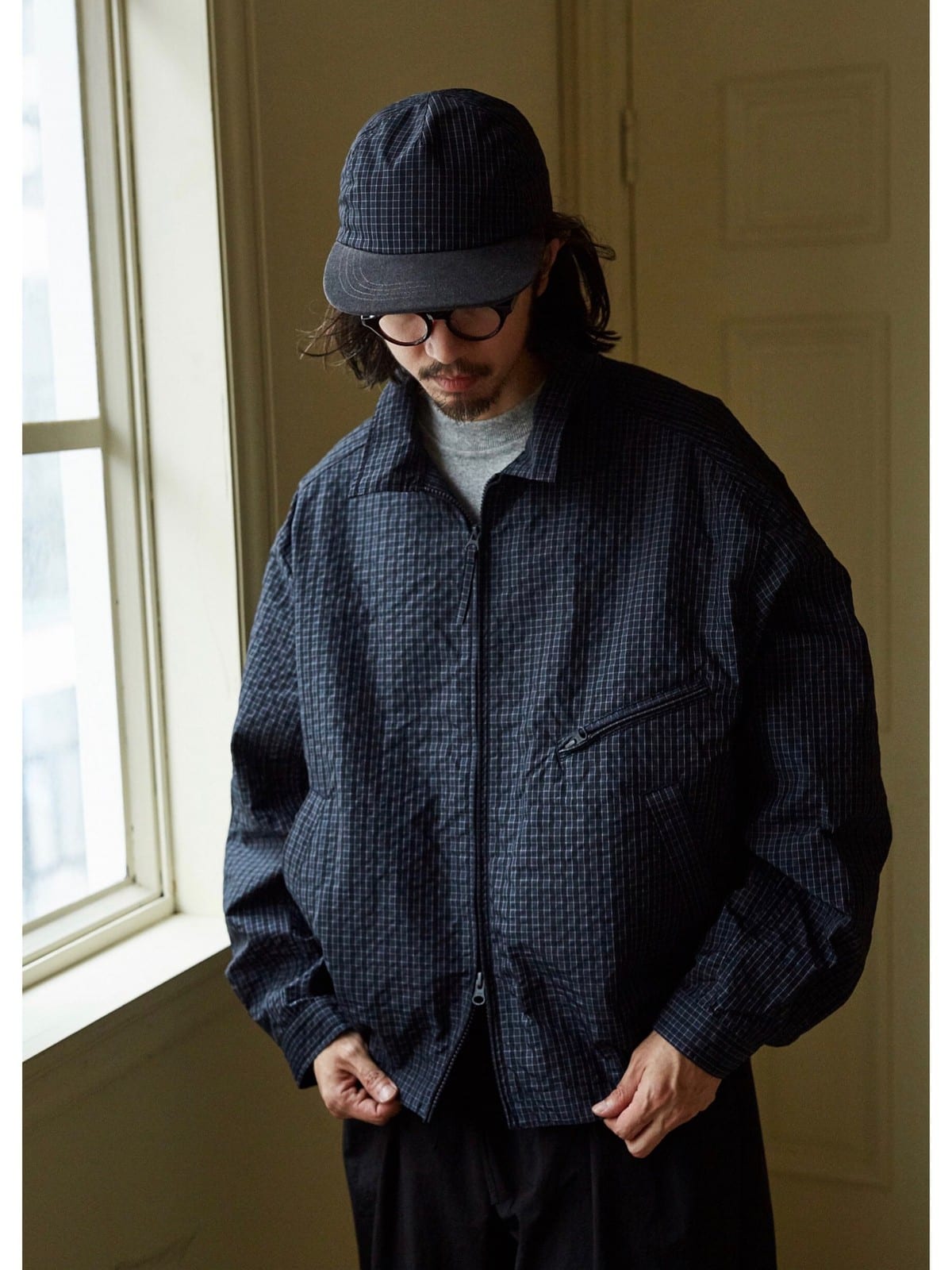 USAGE Jacquard Check Harrington Jacket in Navy Blue - On Male Model