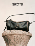 Grotto Pleated Leather Cylinder Bag in Brown - Lifestyle