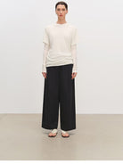 MSBEAST Cotton Blend Tapered Cropped Trousers in Black - On Female Model
