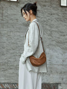 QIUZHEN Vegetable Tanned Leather Crescent Bag in Gray - On Female Model