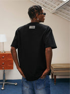 MEDM Pearl Embellished Letter Cotton T Shirt in Black - On Male Model