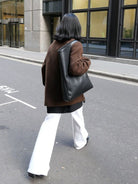 RARELY ALIKE Curved Seam Denim Flare Jeans in White - On Female Model