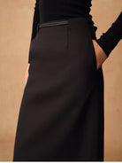 TEASEL Merino Wool Pleated Trousers in Black - On Female Model