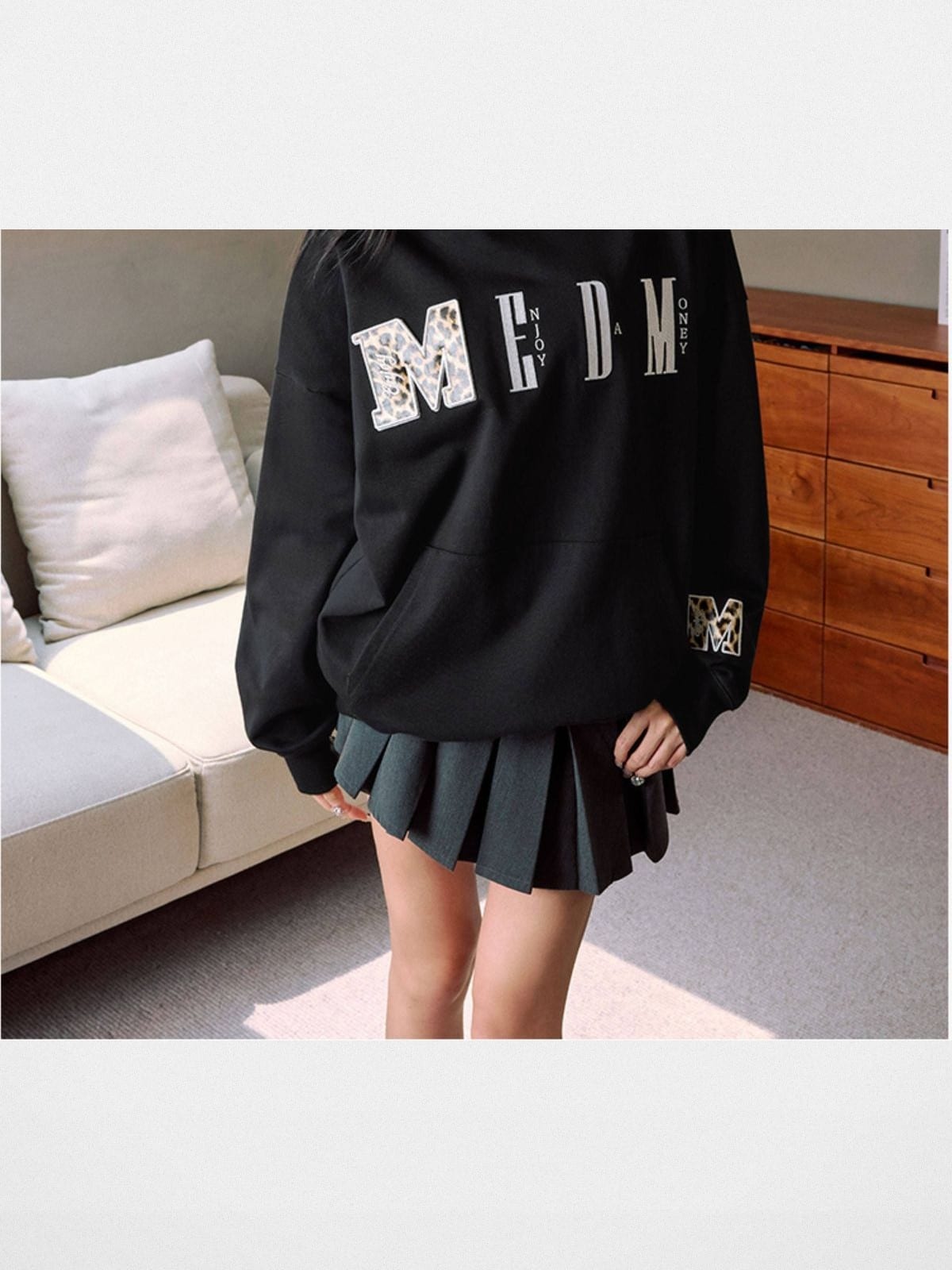 MEDM Animal Print Logo Pullover Hoodie in Black - On Female Model