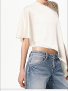 RARELY ALIKE Asymmetrical Satin One Shoulder Blouse in White - On Female Model