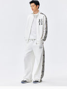 MEDM Lace Paneled Striped Track Pants in White - On Male Model