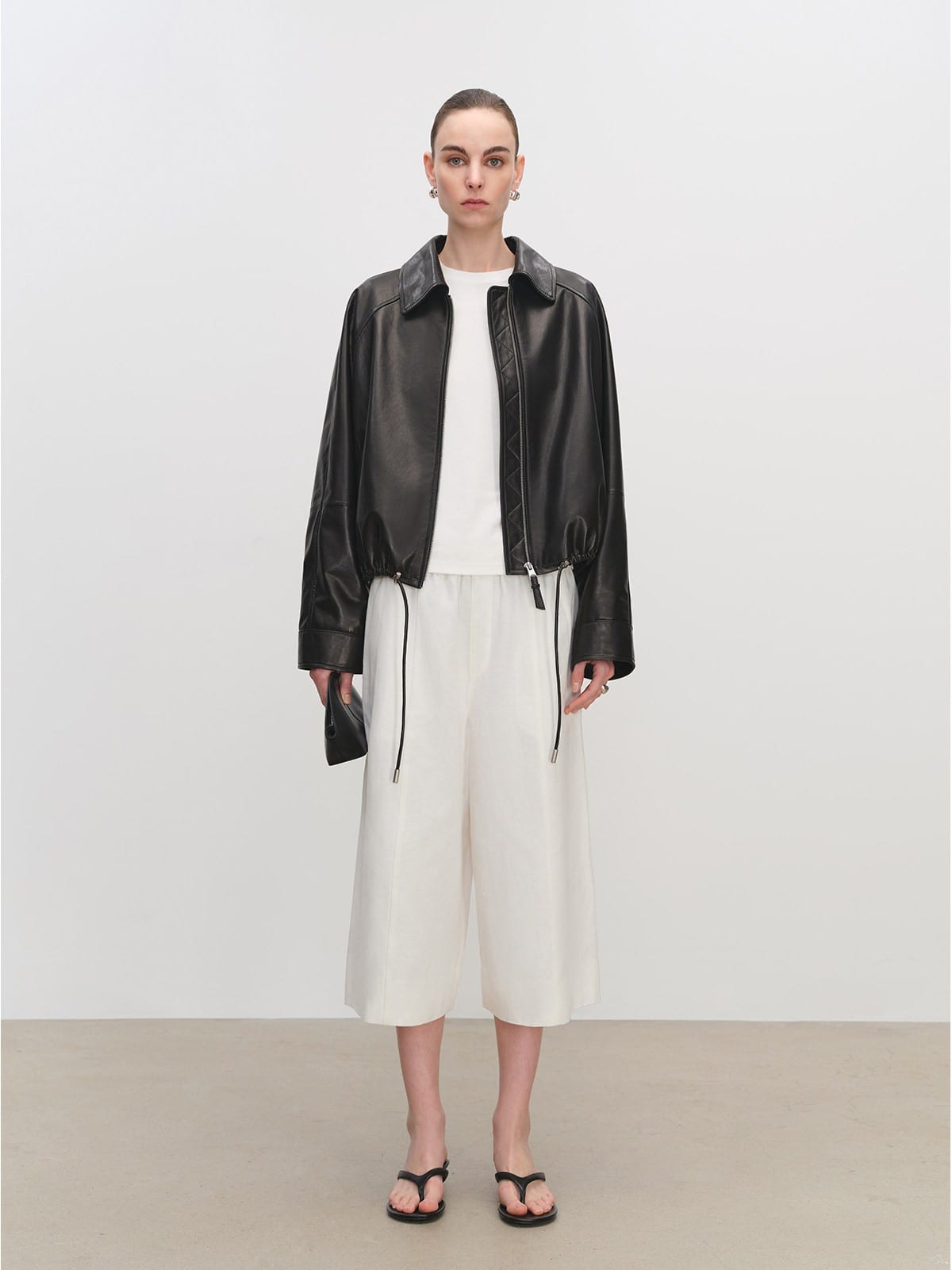 MSBEAST Cropped Leather Drawstring Jacket in Black - On Female Model