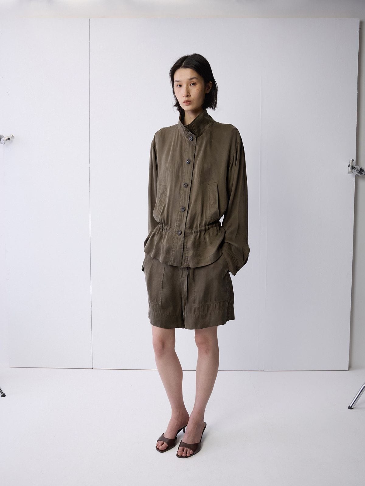 Random Piece Washed Stand Collar Peplum Jacket in Olive - On Female Model