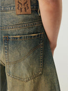 SIMPLE PROJECT Distressed Heavy Wash Denim Shorts in Blue - On Model