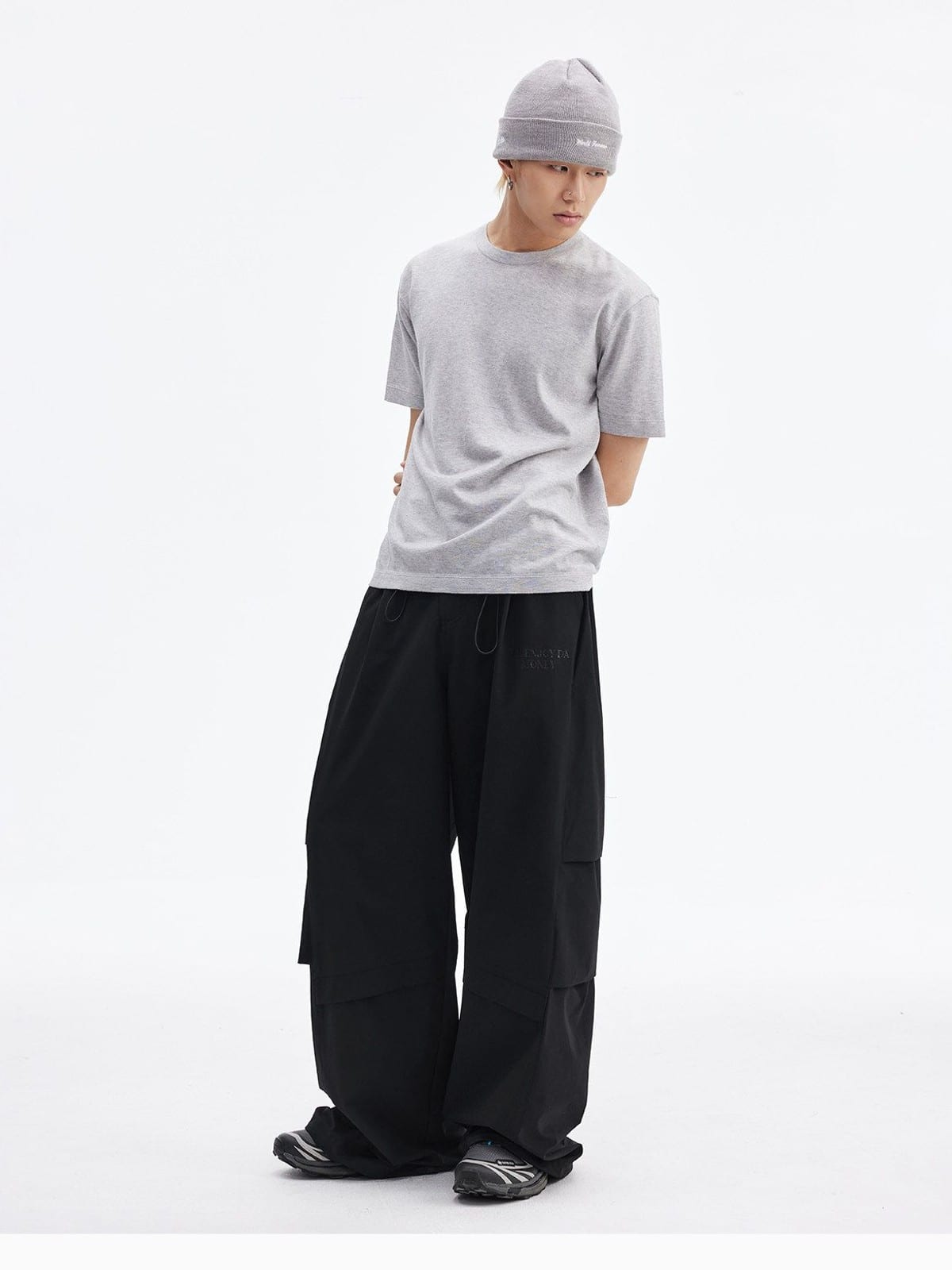 MEDM Crinkled Nylon Parachute Cargo Pants in Black - On Male Model