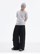 MEDM Crinkled Nylon Parachute Cargo Pants in Black - On Male Model