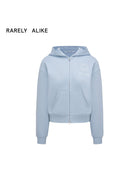RARELY ALIKE Graphic Cropped Zip Up Hoodie in Sky Blue