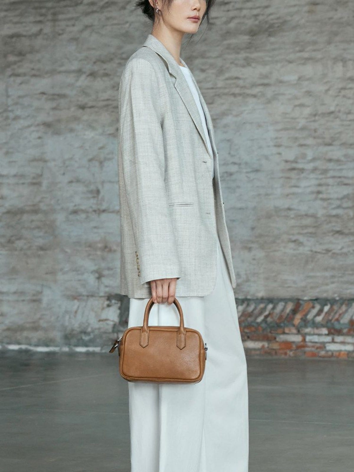 QIUZHEN Vegetable Tanned Leather Bowling Bag in Gray - On Female Model