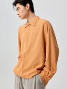 SIMPLE PROJECT Lyocell Ramie Pleated V Neck Shirt in Orange - On Male Model