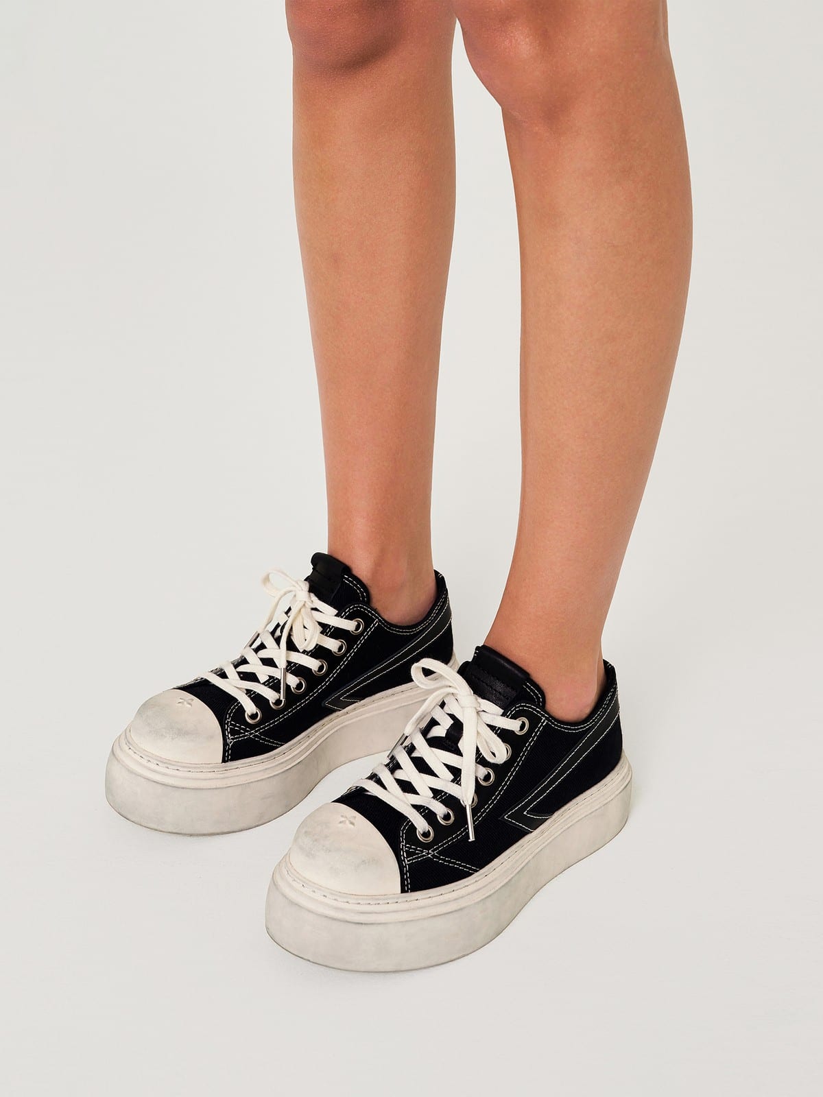SMFK Distressed Canvas Skate Sneakers in Black - On Female Model