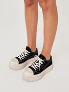 SMFK Distressed Canvas Skate Sneakers in Black - On Female Model