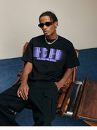 MEDM Glitch Logo Graphic Cotton T Shirt in Purple - On Male Model