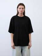 Random Piece Cotton Drop Shoulder T Shirt in Black - On Female Model