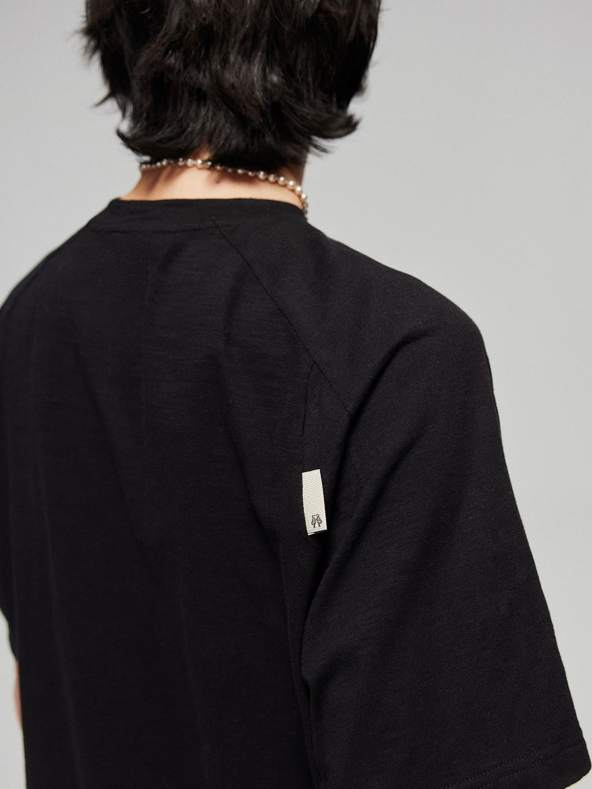SIMPLE PROJECT Washed Slub Cotton Raglan Tee in Black - On Model