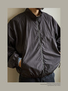 USAGE Lightweight Nylon Zip Up Jacket in Gray - On Male Model