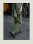 USAGE Heavyweight Herringbone Twill Belted Trousers in Olive - On Model