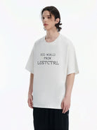 LOSTCTRL Cross Stitch Letter T Shirt in White - On Male Model