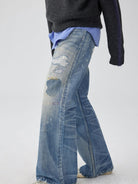 SIMPLE PROJECT Distressed Patchwork Flared Jeans in Blue - On Model