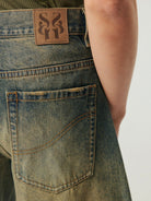 SIMPLE PROJECT Distressed Heavy Wash Denim Shorts in Blue - On Model