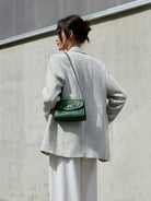 QIUZHEN Vintage Leather Envelope Crossbody in Green - On Female Model
