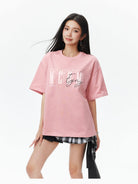 MEDM Vintage Logo Typography Cotton T Shirt in Pink - On Female Model