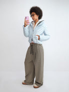 RARELY ALIKE Detachable Hood Duck Down Puffer in Sky Blue - On Female Model
