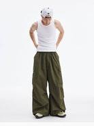 MEDM Multi Pocket Parachute Cargo Pants in Olive - On Male Model