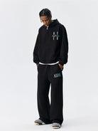 MEDM Embroidered Cotton Blend Zip Up Hoodie in Black - On Male Model
