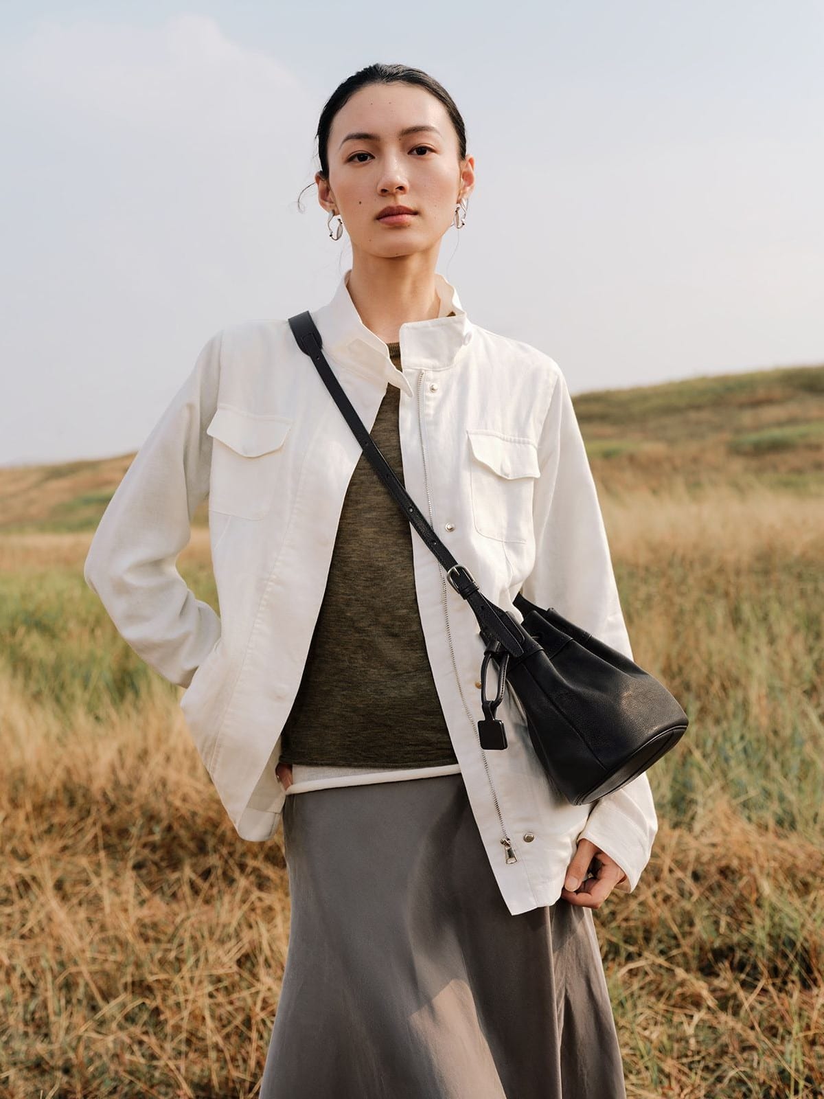 QIUZHEN Kidskin Drawstring Bucket Bag in Black - On Female Model