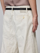 SIMPLE PROJECT Crinkled Straight Leg Trousers in White - On Model