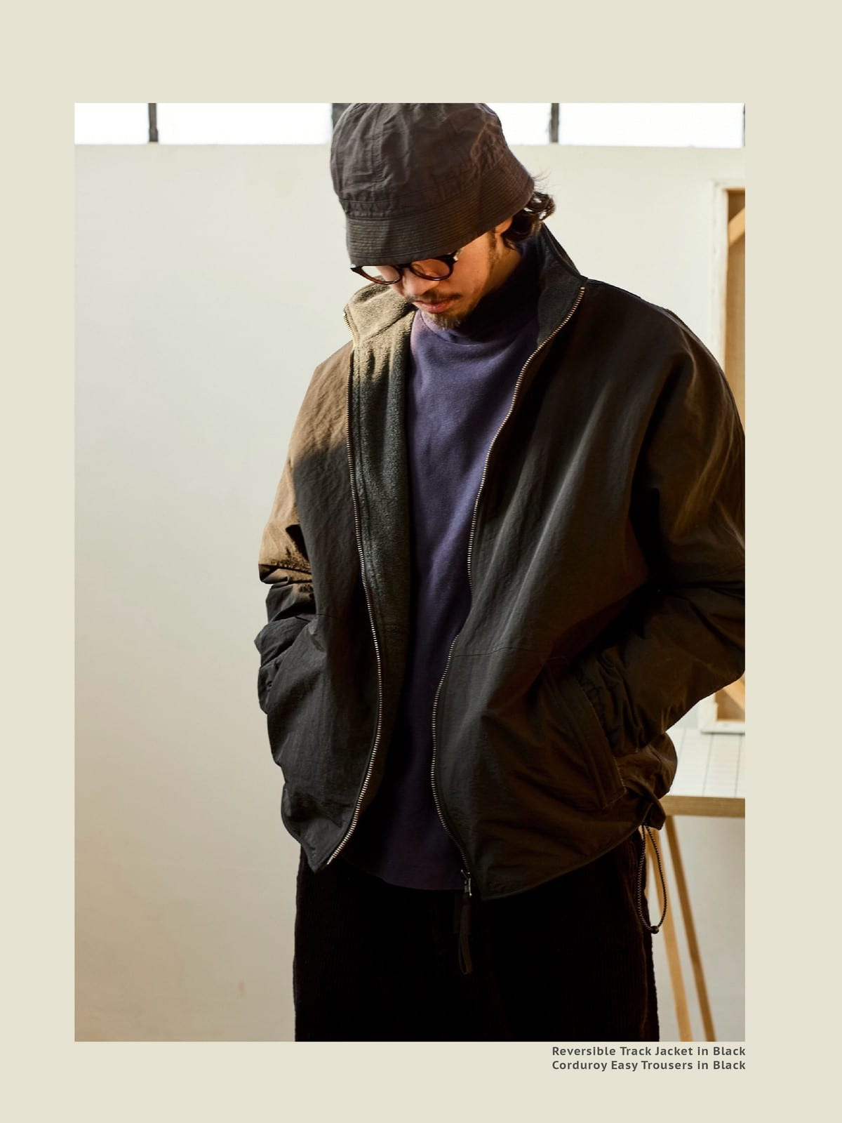 USAGE Reversible Nylon Fleece Track Jacket in Black - On Male Model