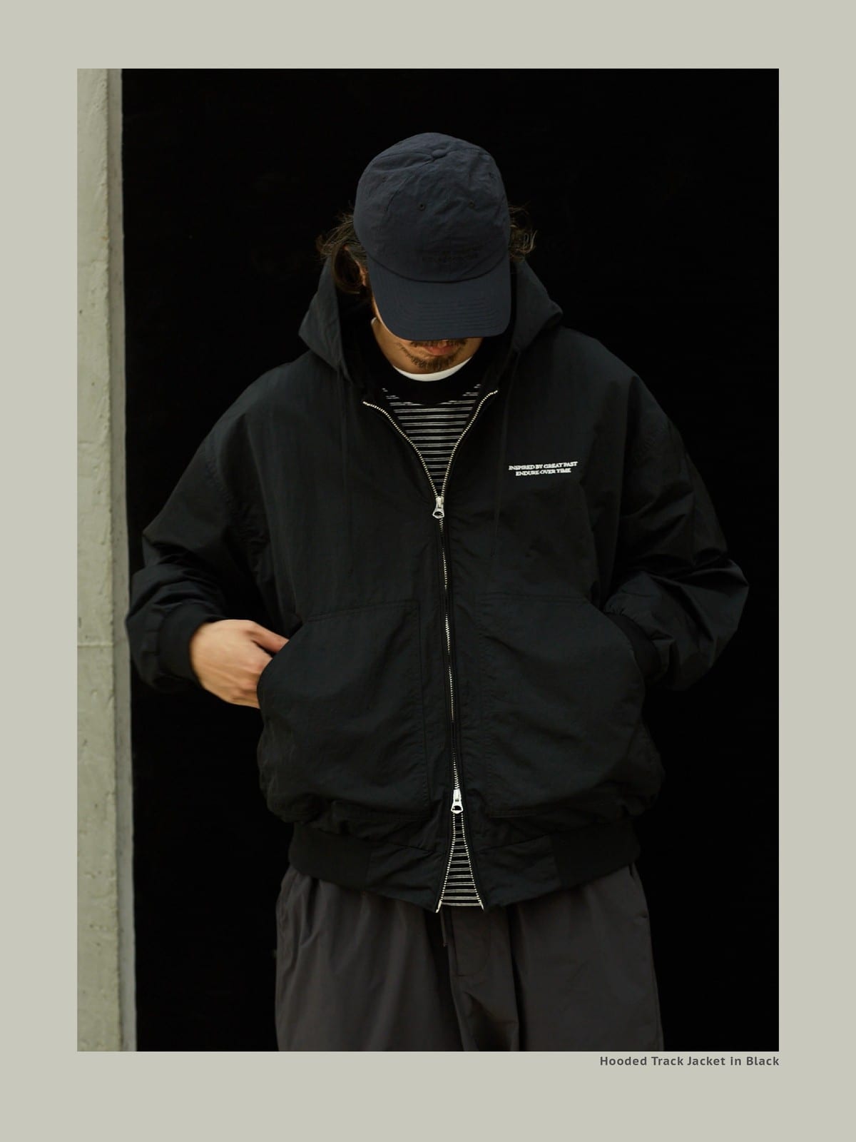 USAGE Crinkle Nylon Hooded Track Jacket in Black - On Male Model