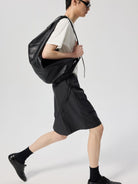 SIMPLE PROJECT Logo Tape Wool Blend Shorts in Gray - On Male Model
